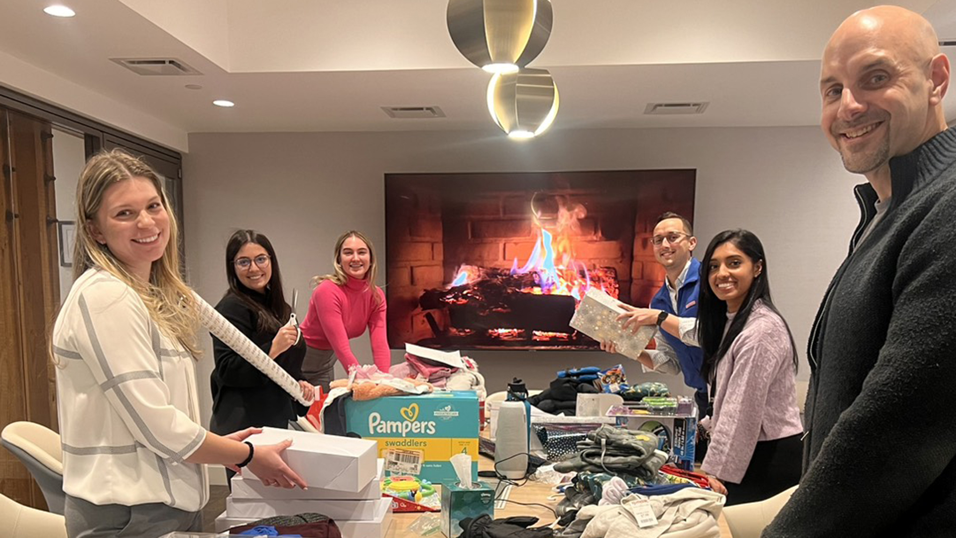 Love, Corbin team wrapping presents for Big Brothers Big Sisters