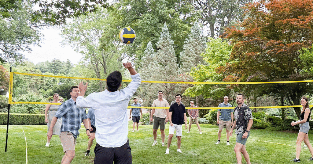 Corbin Advisors summer party playing volleyball